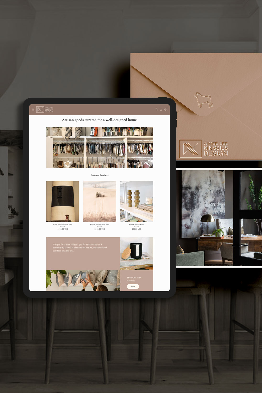 An interior designer's website on an ipad along with branded stationery.