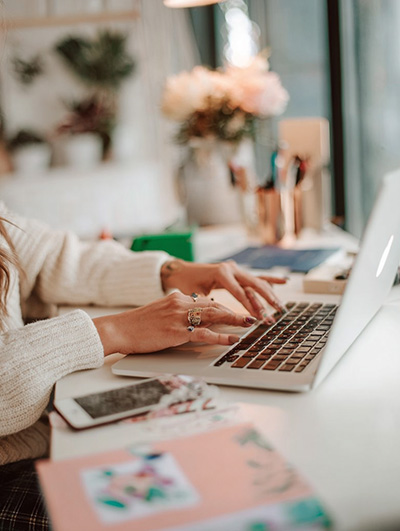 An author working at her laptop at home.